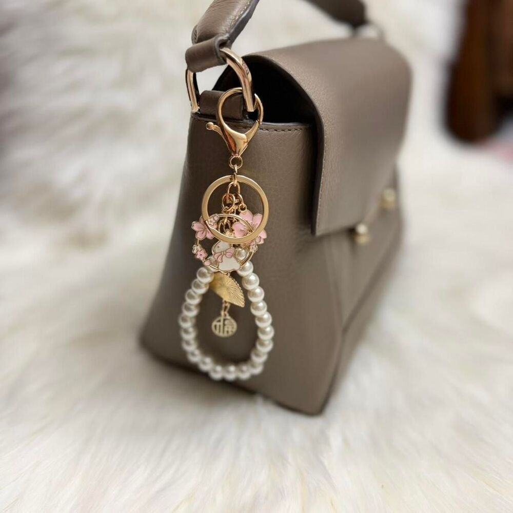 Japanese style pink and pearl keychain with bunny and cherry blossom charms